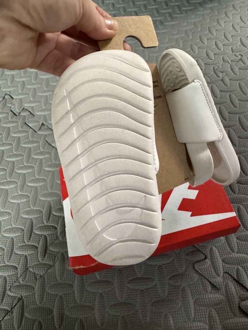 Nike Kawa Slide (TD) Phantom/Sanddrift White Gold (Category: Babies & Kids Fashion) located in Marikina City. Submitted by bangsfrancisco (Listing ID 1459520378, Image 3). Description: Pass as new - Nike Kawa Slides for kids - Color: White with Gold Nike Swoosh - Easy slip-on design - Ideal for beach days or everyday use - Includes original box and tags.