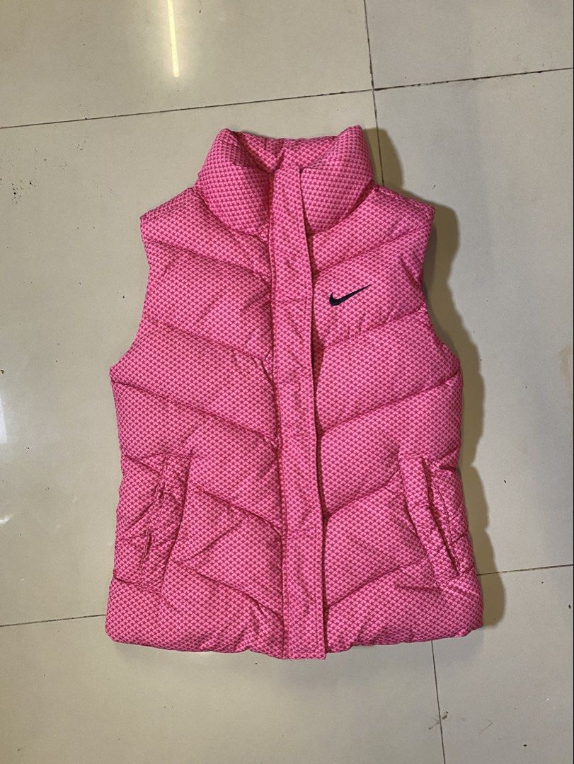 Nike Pink Star Print Puffer Vest (Category: Coats, Jackets and Outerwear) located in Manila. Submitted by mnlwiz_ (Listing ID 1459561227, Image 1). Description: - Cute pink Nike puffer vest - All-over star pattern - Stand-up collar for extra warmth - Zipper closure with Nike zip pull - Two side pockets - Great for layering W-13 L-17.