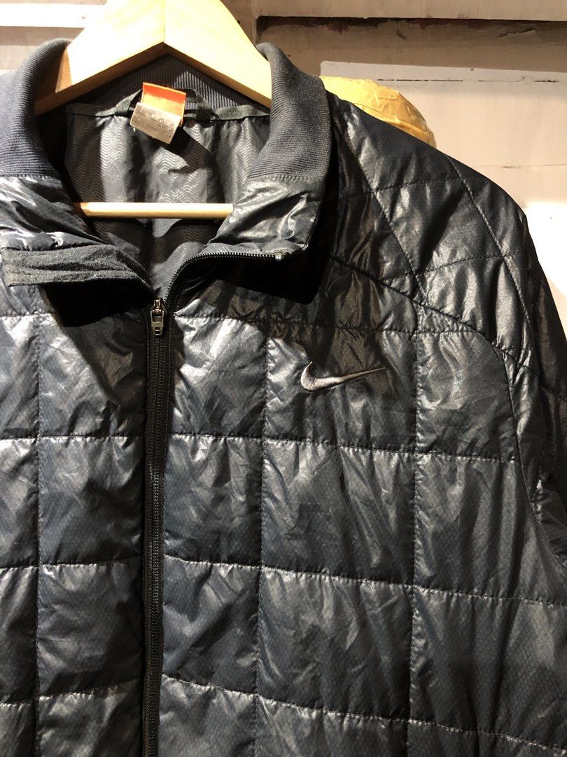 Nike puffer jacket (Category: Coats, Jackets and Outerwear) located in Manila. Submitted by talkshit-20 (Listing ID 1459667846, Image 2). Description: Nike puffer jacket Size Large (23 width/ 28 length) Used Issue: un noticeable discoloration Slash hole sa loob ng fabric hindi tagusan.