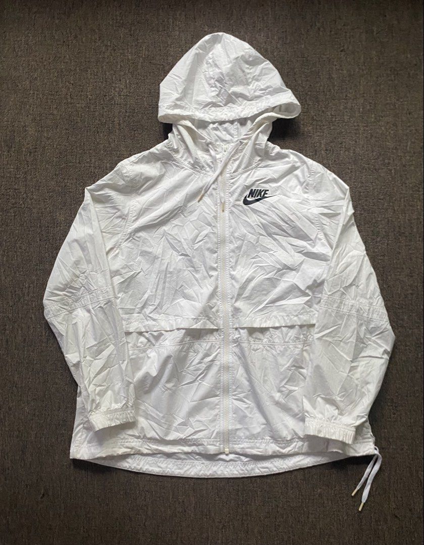 Nike White Hooded Windbreaker Jacket (Category: Coats, Jackets and Outerwear) located in Olongapo. Submitted by WAVYT (Listing ID 1459620405, Image 1). Description: - White Nike jacket with hood - Lightweight material, ideal for windy days or light rain - Front pockets for convenience - Drawstring at the hem for adjustable fit - Minor stains on sleeve (please check photos) - Made in Vietnam.