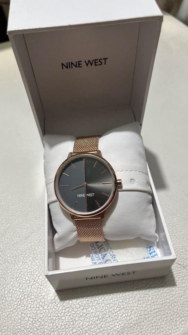 Nine West Gold Mesh Strap Watch (Category: Women's Watches) located in Paranaque City. Submitted by pens2024.39 (Listing ID 1459613307, Image 1). Description: - Brand: Nine West - Color: Gold - Strap: Mesh - Dial: Dark Grey & Black - Includes: Original box with desiccant packet.