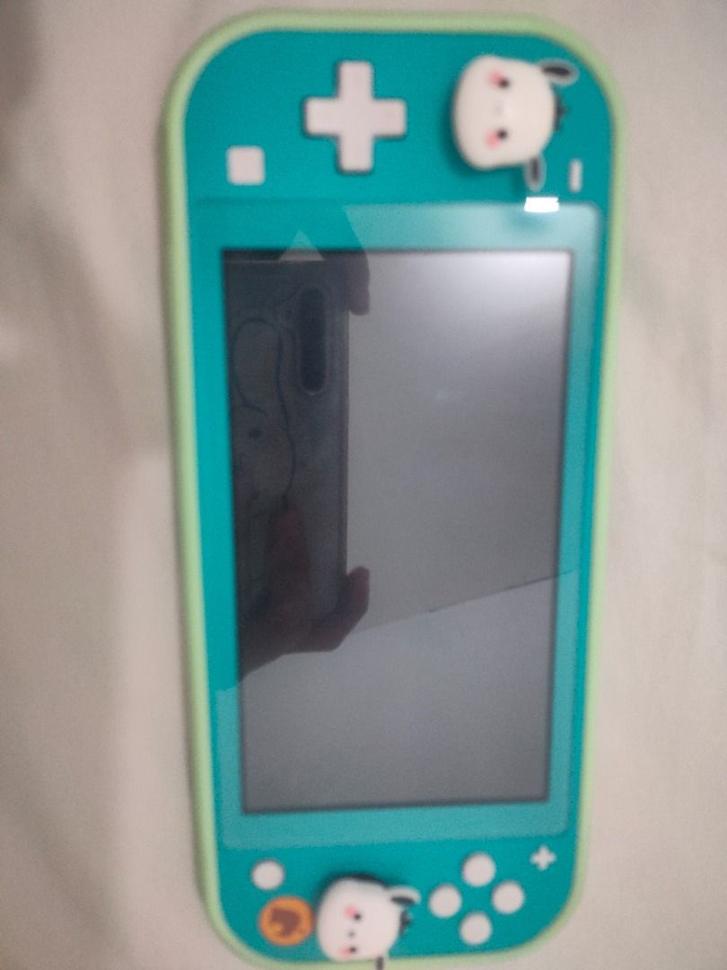 Nintendo switch lite w/ animal crossing (Category: Nintendo) located in Caloocan City. Submitted by kkduck1210 (Listing ID 1459648070, Image 3). Description: Nintendo switch lite special animal crossing version of the console with animal crossing game. Rarely used. Good condition with original charger, with screen protector and case .