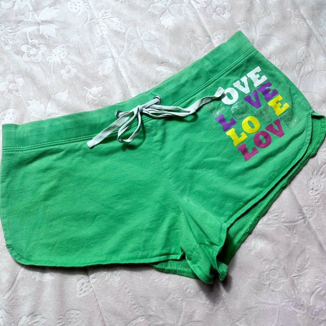 NO BOUNDARIES Green Graphic Shorts (Category: Shorts) located in San Fernando. Submitted by rianne_von (Listing ID 1459590362, Image 2). Description: Size M on tag W: 15.5 in L: 7.5 in info: ✧ bright green lounge shorts w/ multicolor “LOVE” graphic detailing ✧ contrast white drawstring w/ metal eyelets & curved dolphin-style hem ✧ excellent condition; no major flaws observed ✧ color may vary slightly due to lighting.
