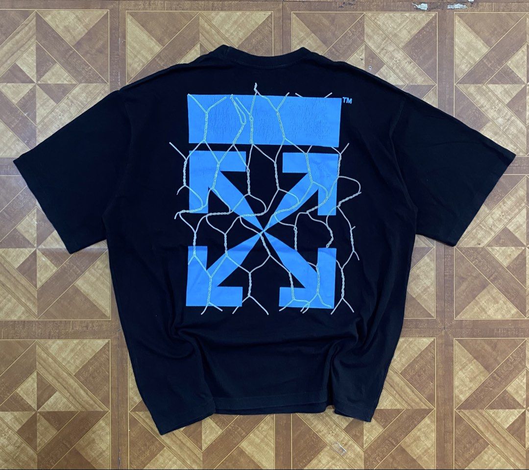 Off-White Black Blue Arrow Graphic T-Shirt (Category: Tshirts & Polo Shirts ) located in Manila. Submitted by jannexthrifting (Listing ID 1459530651, Image 2). Description: Off-White Fence Arrow Excellent condition💯 Color rate: 10/10💯 Size: XL Actual dimensions: Width 24 | Length 27.5 Issue: Print Hairlines NEED WASH ‼️ Mode of payment: Cash or Gcash💸 Can do ship nation wide via JnT🚚 Meet up within Talisay area only🤗 Color may vary due to li