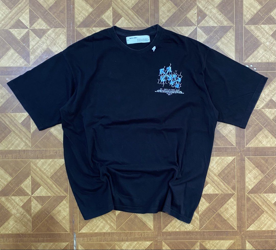 Off-White Black Blue Arrow Graphic T-Shirt (Category: Tshirts & Polo Shirts ) located in Manila. Submitted by jannexthrifting (Listing ID 1459530651, Image 3). Description: Off-White Fence Arrow Excellent condition💯 Color rate: 10/10💯 Size: XL Actual dimensions: Width 24 | Length 27.5 Issue: Print Hairlines NEED WASH ‼️ Mode of payment: Cash or Gcash💸 Can do ship nation wide via JnT🚚 Meet up within Talisay area only🤗 Color may vary due to li
