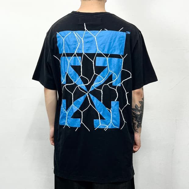 Off-White Black Blue Arrow Graphic T-Shirt (Category: Tshirts & Polo Shirts ) located in Manila. Submitted by jannexthrifting (Listing ID 1459530651, Image 1). Description: Off-White Fence Arrow Excellent condition💯 Color rate: 10/10💯 Size: XL Actual dimensions: Width 24 | Length 27.5 Issue: Print Hairlines NEED WASH ‼️ Mode of payment: Cash or Gcash💸 Can do ship nation wide via JnT🚚 Meet up within Talisay area only🤗 Color may vary due to li