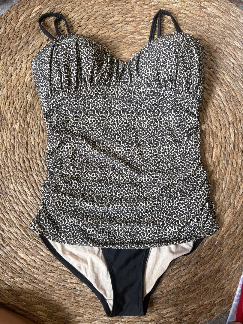 Old Navy Leopard Print Ruched one piece (Category: Bikinis & Swimsuits) located in Malabon City. Submitted by lheithriftshop (Listing ID 1459549182, Image 2). Description: - Old Navy leopard print one piece - Flattering ruched sides - Adjustable straps for a perfect fit - Built-in bra cups for support - Comes with a matching black bikini bottom - Ideal for beach and pool outings #01.