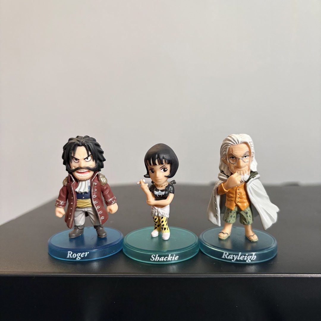 One Piece Roger, Shakky, Rayleigh Chibi Figures (Category: Figurines & Statues) located in Manila. Submitted by tj.merch (Listing ID 1459503631, Image 1). Description: - Includes: Gol D. Roger, Shakky, Silvers Rayleigh - Each figure stands on a clear blue base with their name printed - Ideal for display on shelves or desks - A must-have for any One Piece fan's collection.