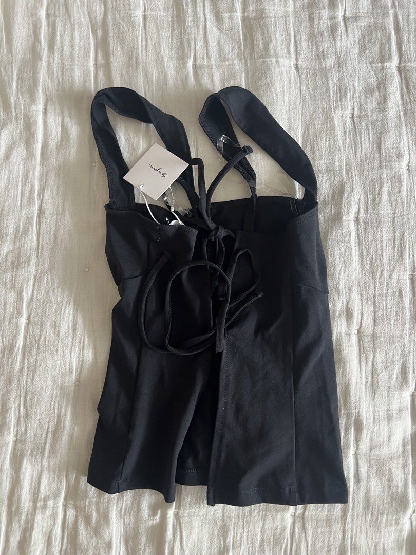 [ONHAND] Supre - Remi backless top black (Category: Sleeveless) located in Cebu City. Submitted by angel.energyph2 (Listing ID 1459629546, Image 3). Description: 🏷️ 750 Size XXS * Bust: 31.5 in (80 cm) * Waist: 24.4 in (62 cm) * Best fits: XXS/XS - Brand new with tag - Square neck - Fitted - Backless - Regular length - Straight hem - Responsibly sourced: Made from 20% recycled cotton from pre-consumer waste .