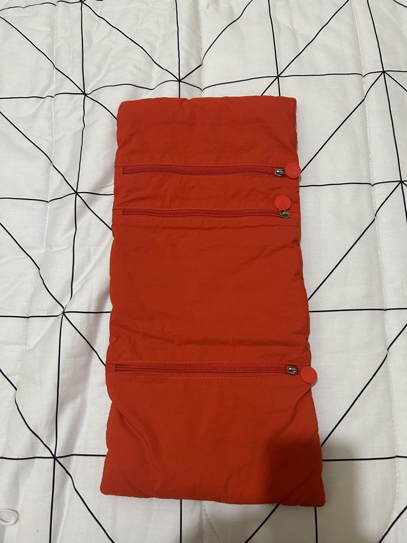 Orange Puffer Pouch with Buckle Strap (Category: Purses & Pouches) located in Manila. Submitted by donnadumaguin (Listing ID 1459626073, Image 3). Description: - Bright orange puffer pouch - Secure buckle strap closure - Unfolds to reveal multiple zippered compartments - Ideal for organizing essentials - Compact and portable design - Perfect for travel or everyday carry.