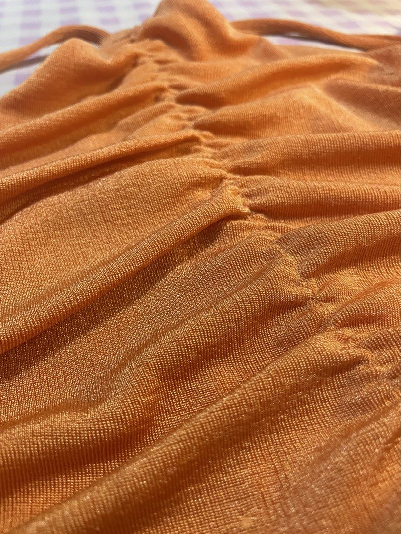 Orange Ruched Halter Neck Crop Top (Category: Sleeveless) located in Quezon City. Submitted by lovenzie (Listing ID 1459676420, Image 3). Description: ⋆˚꩜｡𐔌՞. .՞𐦯⋆. 𐙚 ˚ . . . 🛒🎐 - size small, never worn ! - stretchy fabric with subtle shimmer - great for beach days or night outs >< - pairs well with high-waisted jeans or skirts : P 🛍️🍡 ౨ৎ⋆ ˚｡ mop: gcash shipping: lalamove / grab ( shipping fee will be shouldered by the buyer ) 🍰 loc: qc !