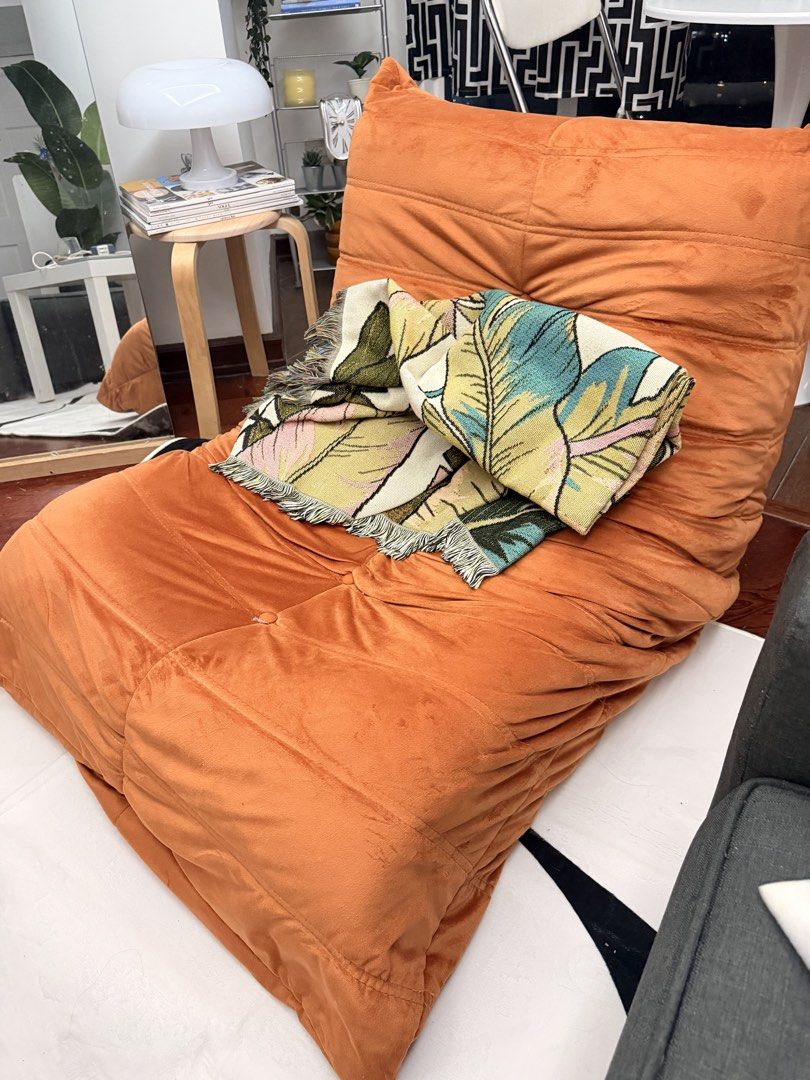 Orange Togo Inspired Chair (Category: Chairs) located in Quezon City. Submitted by acpacs (Listing ID 1459542444, Image 3). Description: Togo Inspired Chair Color: Orange Good condition no flaws For pickup at Cubao area .