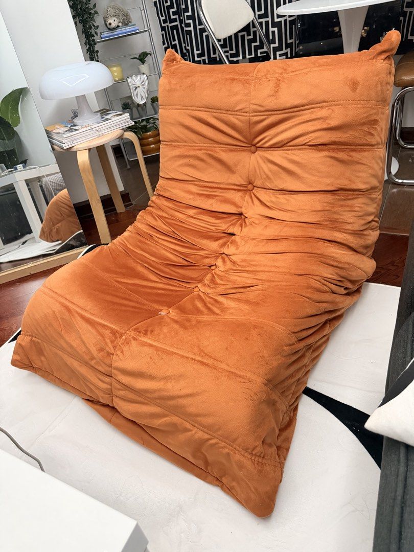 Orange Togo Inspired Chair (Category: Chairs) located in Quezon City. Submitted by acpacs (Listing ID 1459542444, Image 1). Description: Togo Inspired Chair Color: Orange Good condition no flaws For pickup at Cubao area .