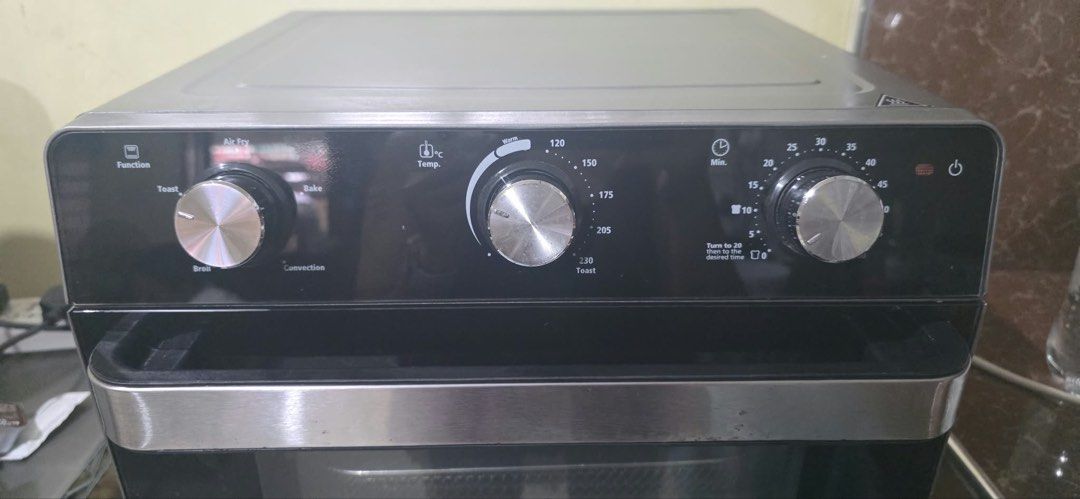 Oster Air Fryer Toaster Oven (Category: Ovens & Toasters) located in Manila. Submitted by chicmom.of.3 (Listing ID 1459544614, Image 2). Description: - Oster Air Fryer Oven - Functions: Air Fry, Toast, Bake, Broil, Convection - Temperature: Up to 230°C - Timer: Up to 60 minutes - Accessories: Air Fry Basket, Baking Tray - Ideal for versatile cooking and baking.