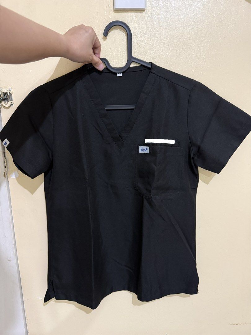 OTG & Wenurse Scrub Tops (Category: Others Tops) located in Antipolo. Submitted by shopclozette (Listing ID 1459607648, Image 2). Description: - Comfortable V-neck scrub tops - Available colors: Royal Blue, Black, Purple, Light Blue, Lavender - Some styles include a chest pocket - Ideal for medical professionals and durable workwear - It all comes with a pants - Will have the embroidery removed before shipping - Negotiable if you buy more than 2 