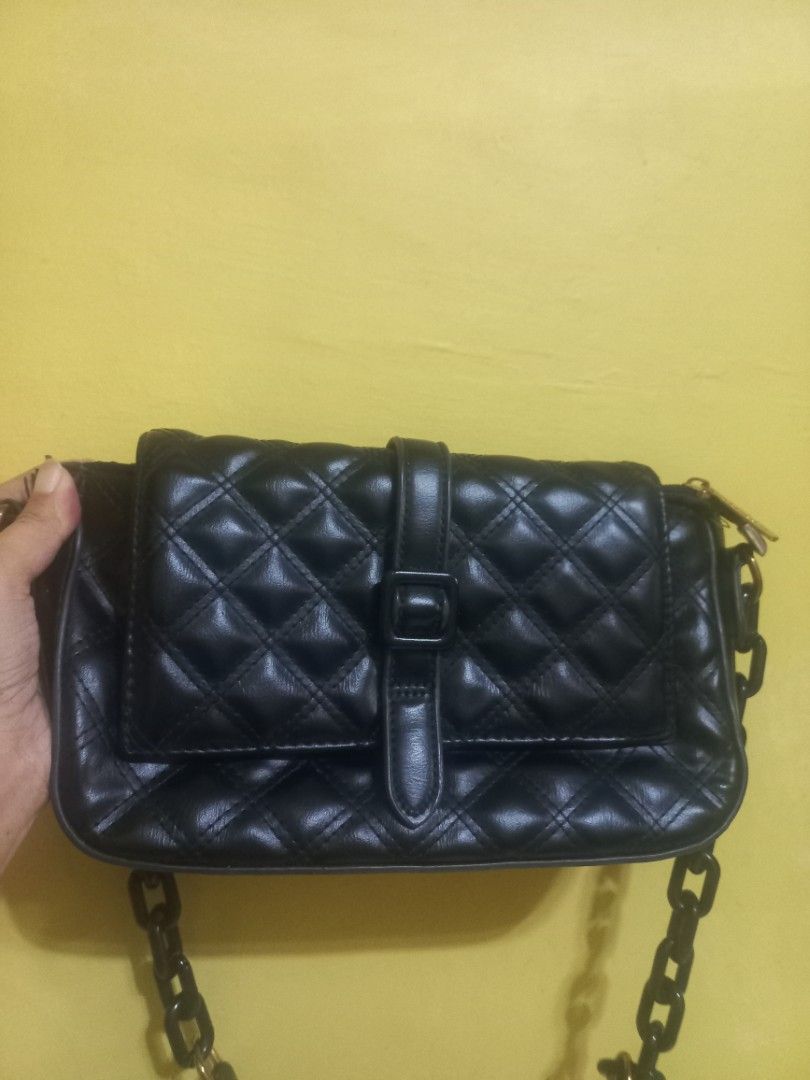 Parisian Black Quilted Shoulder Bag (Category: Shoulder Bags) located in Manila. Submitted by mrose_2412 (Listing ID 1459578943, Image 1). Description: ✨ Classic and elegant design ✨ Black color – easy to match with any outfit ✨ Chain shoulder strap ✨ Front buckle detail ✨ Perfect for casual or semi-formal occasions ✨ Still in good condition.