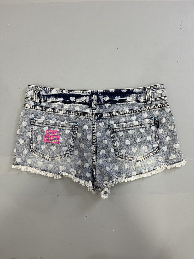 Paul Frank Denim Shorts with Heart Print and Monkey Patch (Category: Shorts) located in Mabalacat. Submitted by aas_thriftfings (Listing ID 1459574535, Image 2). Description: - Cute Paul Frank denim shorts - Size 28 - All-over white heart print - Fun monkey patch on left leg - Frayed hem detail - Pink Paul Frank logo on the back.