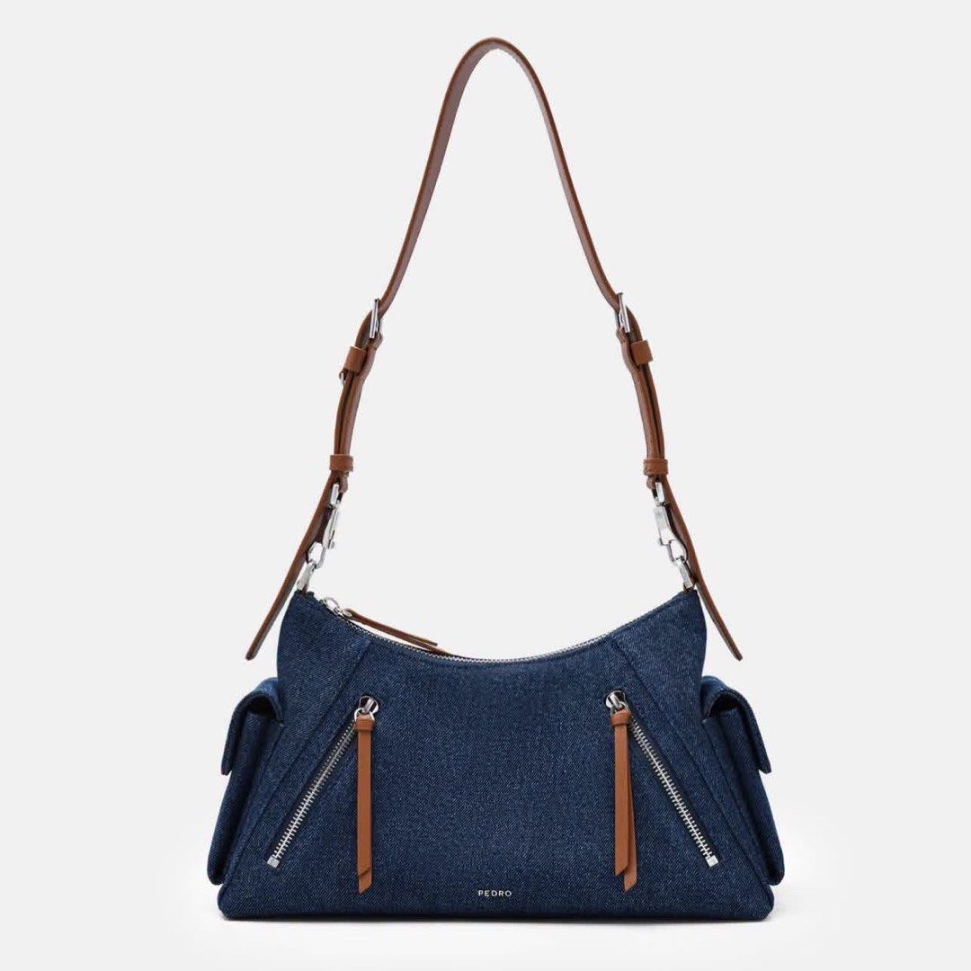 Pedro Kristen Denim Shoulder Bag (Category: Shoulder Bags) located in Pasig City. Submitted by ff.ph (Listing ID 1459645776, Image 1). Description: Denim Shoulder Bag with Leather Trim Size 12.5 inches Multi Pockets Zip closure Adjustable Shoulder Strap With Echodustbag and serial number With tag Add paperbag plus 80 .