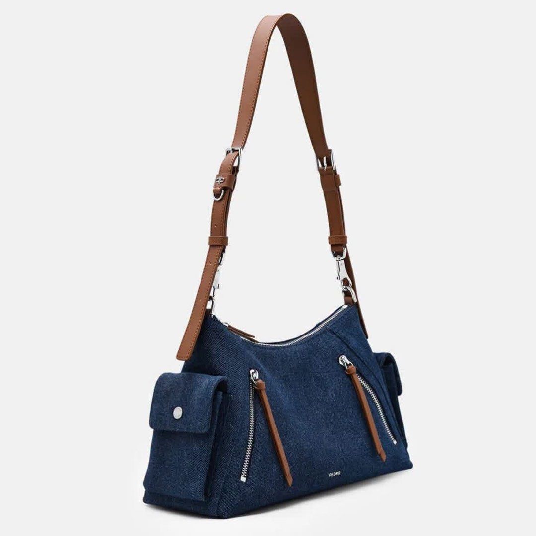 Pedro Kristen Denim Shoulder Bag (Category: Shoulder Bags) located in Pasig City. Submitted by ff.ph (Listing ID 1459645776, Image 2). Description: Denim Shoulder Bag with Leather Trim Size 12.5 inches Multi Pockets Zip closure Adjustable Shoulder Strap With Echodustbag and serial number With tag Add paperbag plus 80 .