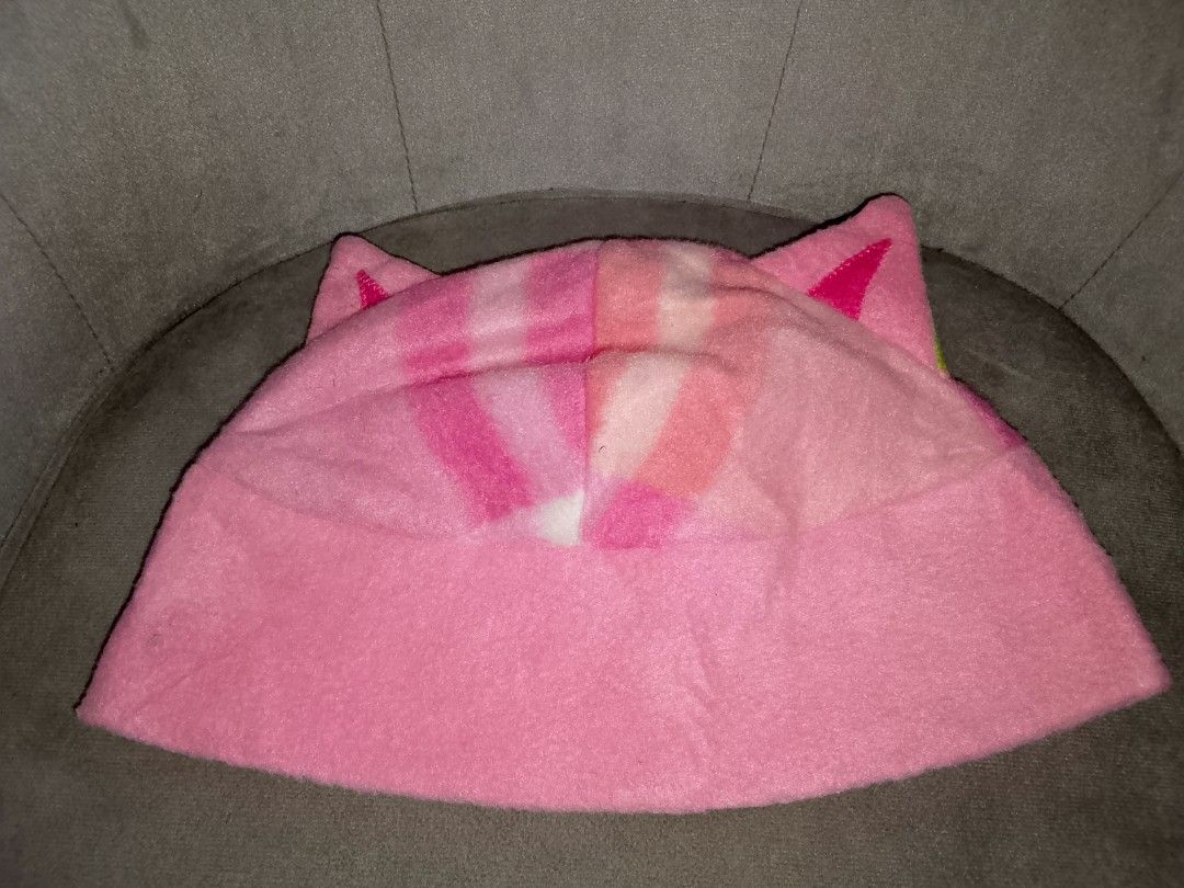 Pink Fleece Cat Ear Beanie (Category: Hats & Beanies) located in Binangonan. Submitted by yuristalin888 (Listing ID 1459577925, Image 3). Description: Add a playful touch to your wardrobe with this pink fleece cat-ear beanie. Crafted from a soft, fuzzy fabric, it features whimsical upright cat ears, a solid pink brim, and a colorful patterned crown blending shades of pink, white, orange, and green. Cozy, fun, and unique, it's the purrfect accesso