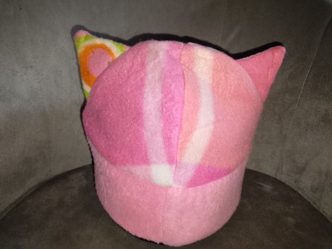 Pink Fleece Cat Ear Beanie (Category: Hats & Beanies) located in Binangonan. Submitted by yuristalin888 (Listing ID 1459577925, Image 2). Description: Add a playful touch to your wardrobe with this pink fleece cat-ear beanie. Crafted from a soft, fuzzy fabric, it features whimsical upright cat ears, a solid pink brim, and a colorful patterned crown blending shades of pink, white, orange, and green. Cozy, fun, and unique, it's the purrfect accesso