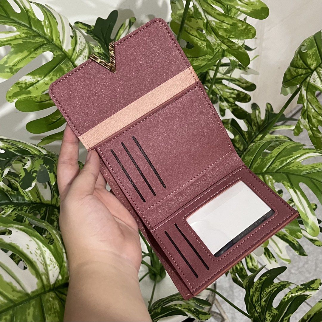 Pink Tri-fold Wallet with Gold Accent (Category: Wallets & Card holders) located in Bacolod City. Submitted by tres_chic_bcd (Listing ID 1459629660, Image 3). Description: - Adorable pink tri-fold wallet - Chic gold V-shaped accent on the flap - Interior card slots and clear ID window - Secure snap closure for peace of mind - Compact size, fits easily in bags or pockets - Ideal for keeping your essentials organized.