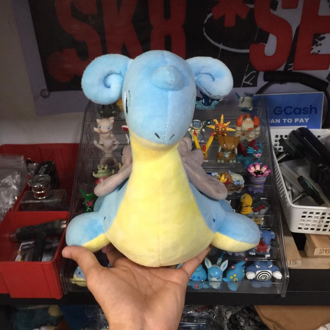 Pokemon Lapras Plush Toy (Category: Plushies & Soft Toys) located in Manila. Submitted by ikawbasiwagwag8 (Listing ID 1459567476, Image 3). Description: - Adorable Lapras plush toy - Approximately 12 inches tall - Super soft and cuddly material - Ideal for any Pokemon enthusiast - Suitable for both playing and displaying - Ready to find its new owner!.