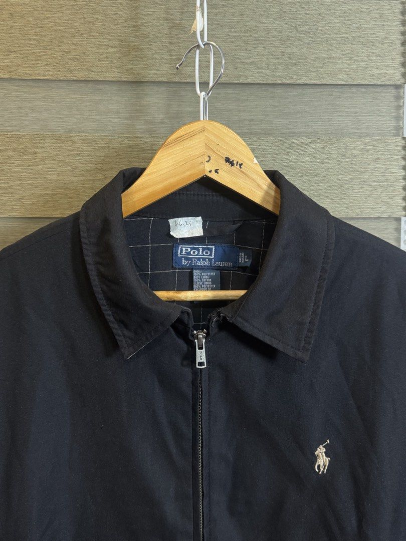 Polo Ralph Lauren Black Jacket Size L (Category: Coats, Jackets and Outerwear) located in Santa Ana. Submitted by thrift.sanctuary (Listing ID 1459626244, Image 2). Description: 26,25 L on tag - Classic black jacket from Polo Ralph Lauren - Iconic polo player logo embroidered on chest - 100% polyester shell and lining - Full zip closure - Perfect for layering - Size: Large (L).