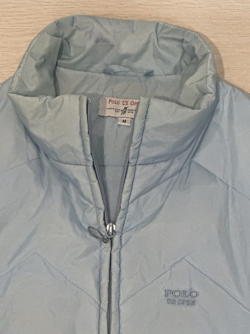 Polo US Open Puffer Vest Size M (Category: Vests) located in Rizal. Submitted by rann1121 (Listing ID 1459588398, Image 2). Description: - Light blue puffer vest - Brand: Polo US Open - Size: Medium (M) - Embroidered Polo US Open logo on chest - Two side pockets - Perfect for layering - Great for golf or casual outfits.