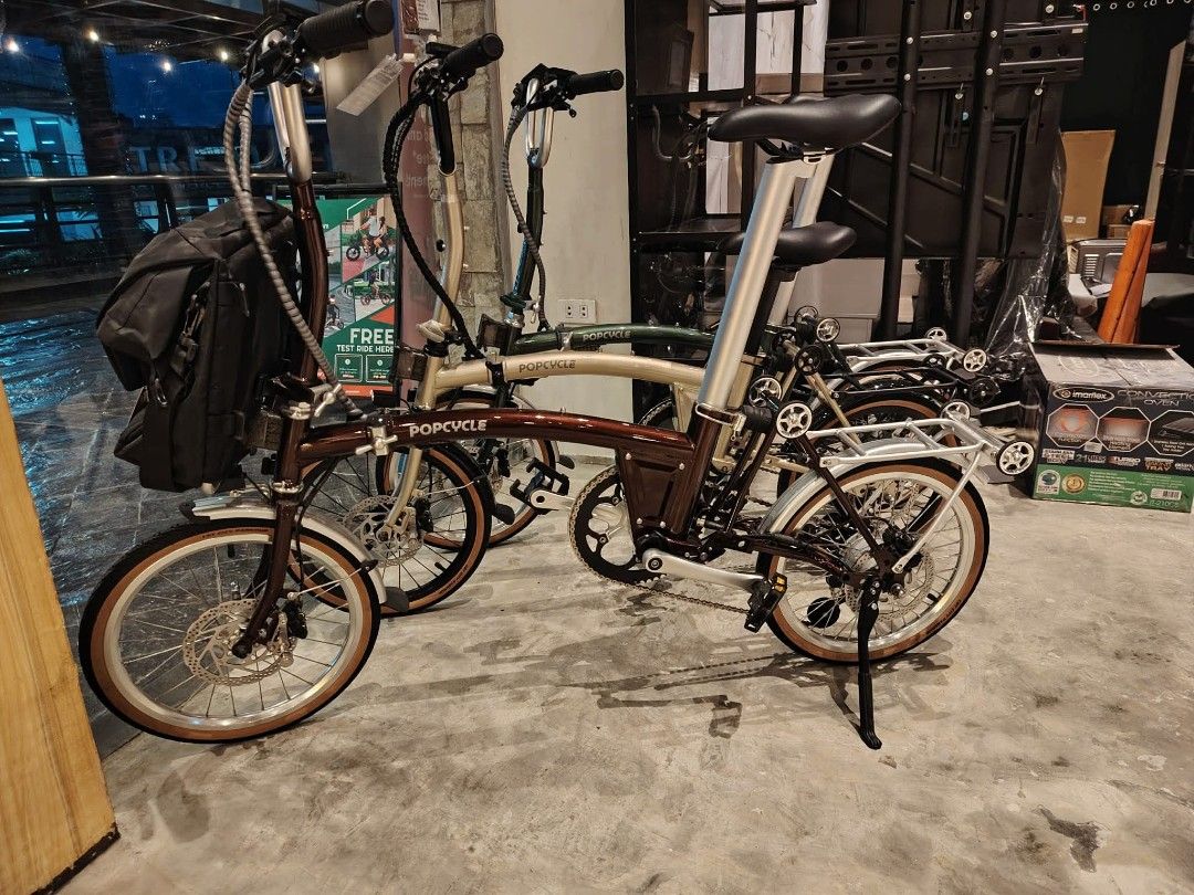 Popcycle Folding Bicycle - Brown and Green (Category: Bicycles) located in Manila. Submitted by jomspopcycle (Listing ID 1459515244, Image 2). Description: - Two Popcycle folding bikes available: one in rich brown, one in classic green. - Both bikes feature the prominent Popcycle logo. - Lightly used, showing minimal signs of wear, and are in good overall condition. - Ideal for daily commuting or relaxed cycling adventures. - Designed for easy fo