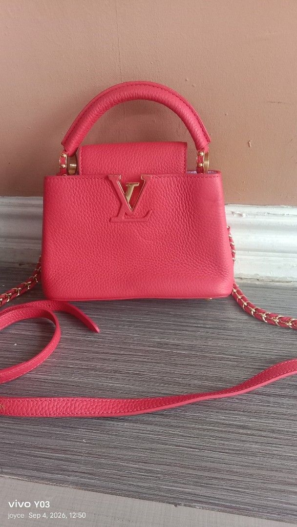 Preloved Louis vuitton Textured Leather Top Handle Bag with Chain Strap (Category: Luxury Bags & Wallets) located in Cabuyao City. Submitted by selections888 (Listing ID 1459535541, Image 1). Description: -preloved from Japan supplier -Cute textured leather bag - Features a top handle and a long chain strap - Elegant gold hardware details - Compact, small size – ideal for carrying essentials - Adds a perfect pop of color to any outfit - Please ch