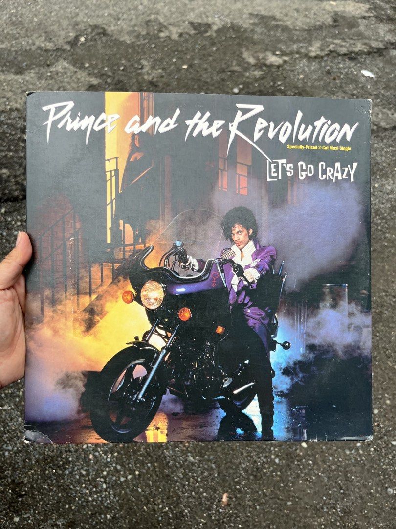 PRINCE AND THE REVOLUTION Let’s Go Crazy 12” (Category: Vinyls) located in Manila. Submitted by rosemaryclothing (Listing ID 1459618106, Image 1). Description: PRINCE AND THE REVOLUTION Let’s Go Crazy 12” Maxi-Single Tracklist: A Let’s Go Crazy (Special Dance Mix) B Erotic City (“Make Love Not War Erotic City Come Alive”) Backing Vocals [Background Vocal] – Sheila E. US pressing, 1984 Outer sleeve and Vinyl in Excellent condition.
