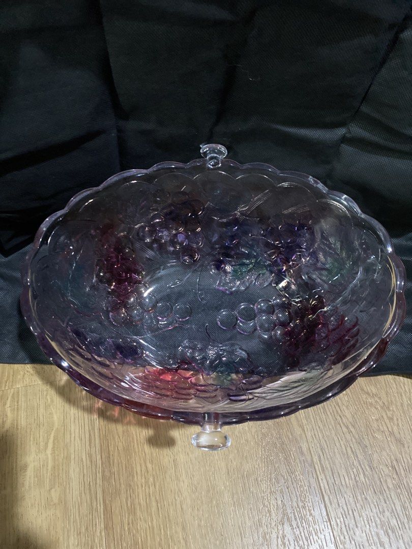 Purple Grape Embossed Glass Serving Bowl (Category: Other Kitchenware & Tableware) located in Taguig. Submitted by cosmickindle (Listing ID 1459569578, Image 2). Description: - Stunning purple glass serving bowl - Elegant grape and leaf embossed design around the rim - Delicate scalloped edge detail - Ideal for serving fruits, salads, or as a decorative centerpiece - Adds a vibrant pop of color to your table - Convenient handles on each side for 