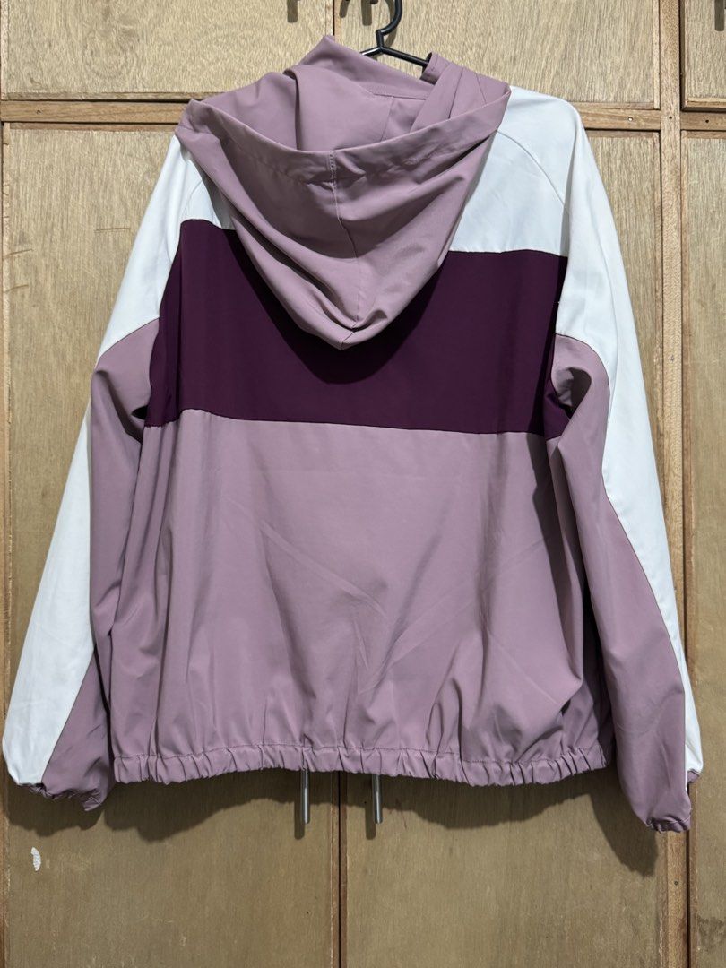 Purple White Windbreaker Jacket with Hood (Category: Coats, Jackets and Outerwear) located in Calamba. Submitted by love.levi (Listing ID 1459590813, Image 2). Description: - Lightweight windbreaker jacket - Stylish colorblock design: white, plum, and dusty rose panels - Full zip front closure - Attached hood for extra protection - Elasticated hem and cuffs for a snug fit - Two convenient side pockets - Ideal for casual wear or light outdoor acti
