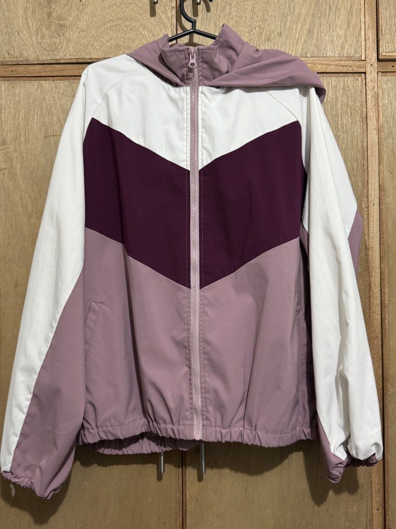 Purple White Windbreaker Jacket with Hood (Category: Coats, Jackets and Outerwear) located in Calamba. Submitted by love.levi (Listing ID 1459590813, Image 1). Description: - Lightweight windbreaker jacket - Stylish colorblock design: white, plum, and dusty rose panels - Full zip front closure - Attached hood for extra protection - Elasticated hem and cuffs for a snug fit - Two convenient side pockets - Ideal for casual wear or light outdoor acti