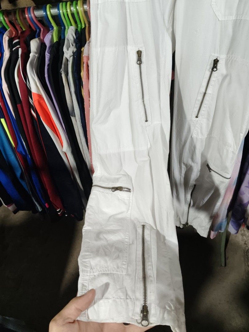 Ralph Lauren White Cargo Pants Size 6 (Category: Other Bottoms) located in Mawab. Submitted by kingacecruda (Listing ID 1459637235, Image 2). Description: - Brand: Ralph Lauren - Color: White - Material: 100% Cotton - Origin: Made in Hong Kong - Features: Multiple zippered pockets on legs - Style: Great for everyday wear or a casual look, easy to style with different tops..