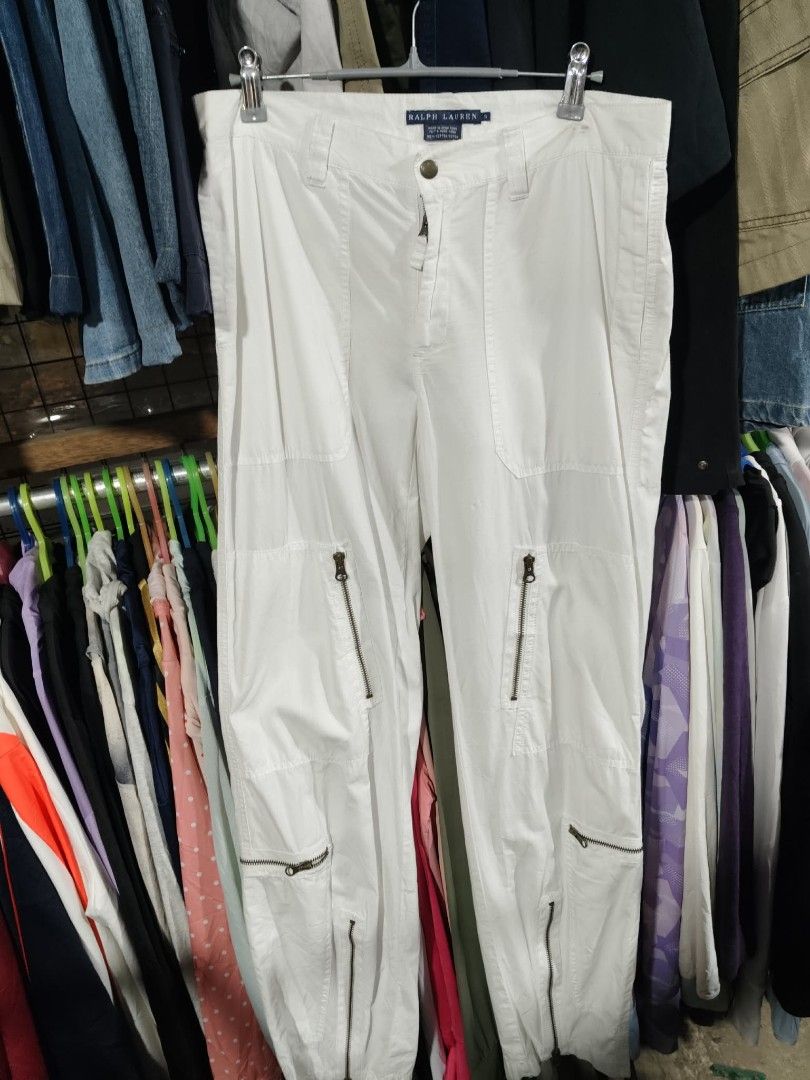 Ralph Lauren White Cargo Pants Size 6 (Category: Other Bottoms) located in Mawab. Submitted by kingacecruda (Listing ID 1459637235, Image 1). Description: - Brand: Ralph Lauren - Color: White - Material: 100% Cotton - Origin: Made in Hong Kong - Features: Multiple zippered pockets on legs - Style: Great for everyday wear or a casual look, easy to style with different tops..