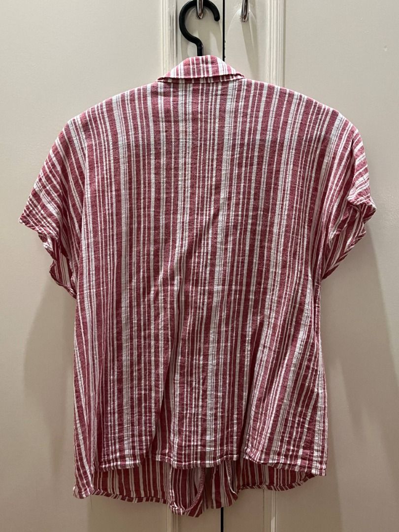 Red and White Striped Button-Up Shirt (Category: Shirts) located in Marikina City. Submitted by piaenrqz (Listing ID 1459664789, Image 3). Description: - Classic red and white vertical stripes. - Short sleeves. - Button-up front with collar. - Relaxed fit for comfort. - Ideal for casual outfits or layering. - PAYO through Gcash or Maya. - Strictly delivery only..