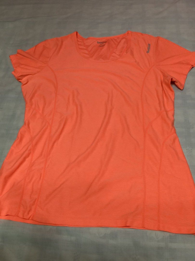 Reebok Orange Athletic T-shirt (Category: Activewear) located in Davao. Submitted by ferdipt (Listing ID 1418779982, Image 1). Description: Designed for training & fitness For Women Size: M Made in Lesotho 96% Polyester, 4% Spandex.