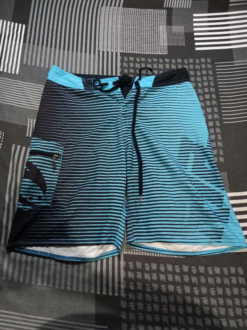 Rip Curl Board Shorts Size 30 Blue Black Stripe (Category: Swim Trunks & Board Shorts) located in Panabo. Submitted by khimmyirish_ki021126 (Listing ID 1459551039, Image 1). Description: - Rip Curl board shorts - Size 30 - Blue and black stripe pattern - Back pocket with zip closure - Drawstring waist - Ideal for swimming or surfing.