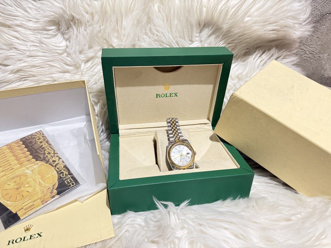 Rolex Oyster Perpetual Datejust Two-Tone Watch (Category: Luxury Watches) located in Caloocan City. Submitted by elusiveclothing (Listing ID 1459608566, Image 2). Description: - Rolex Oyster Perpetual Datejust - Two-tone stainless steel and gold construction - Classic fluted bezel - Comes with original Rolex box and papers - A timeless and iconic timepiece.