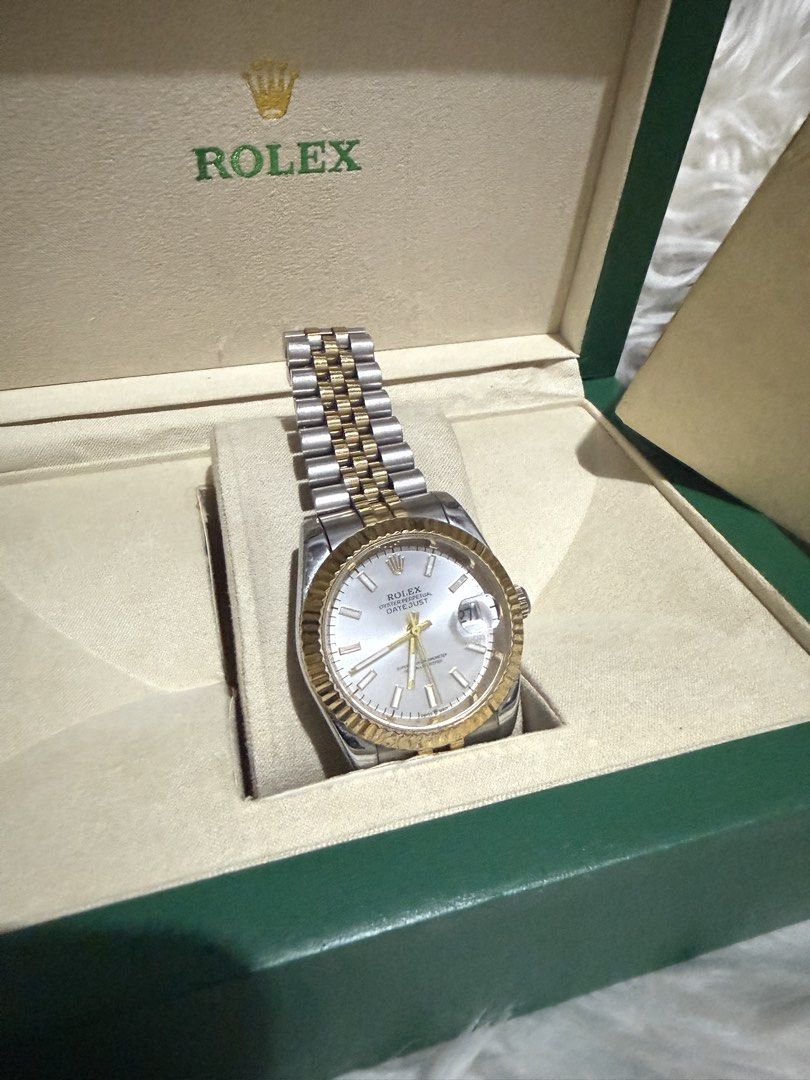 Rolex Oyster Perpetual Datejust Two-Tone Watch (Category: Luxury Watches) located in Caloocan City. Submitted by elusiveclothing (Listing ID 1459608566, Image 1). Description: - Rolex Oyster Perpetual Datejust - Two-tone stainless steel and gold construction - Classic fluted bezel - Comes with original Rolex box and papers - A timeless and iconic timepiece.