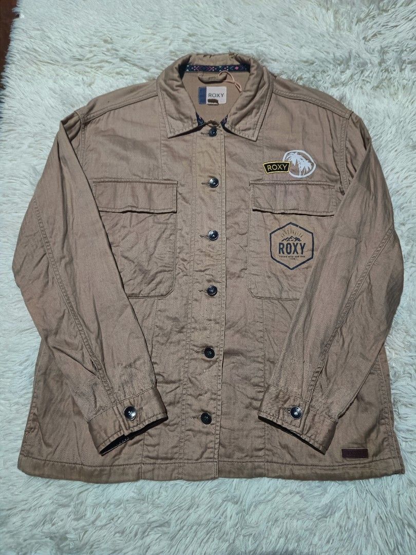 Roxy Brown Utility Jacket with Graphic Back (Category: Coats, Jackets and Outerwear) located in Zamboanga. Submitted by selldamn.vintage (Listing ID 1459673457, Image 1). Description: Roxy Utility Jacket Unisex Rugged Style dimension 21x26 Small - Large fitting.
