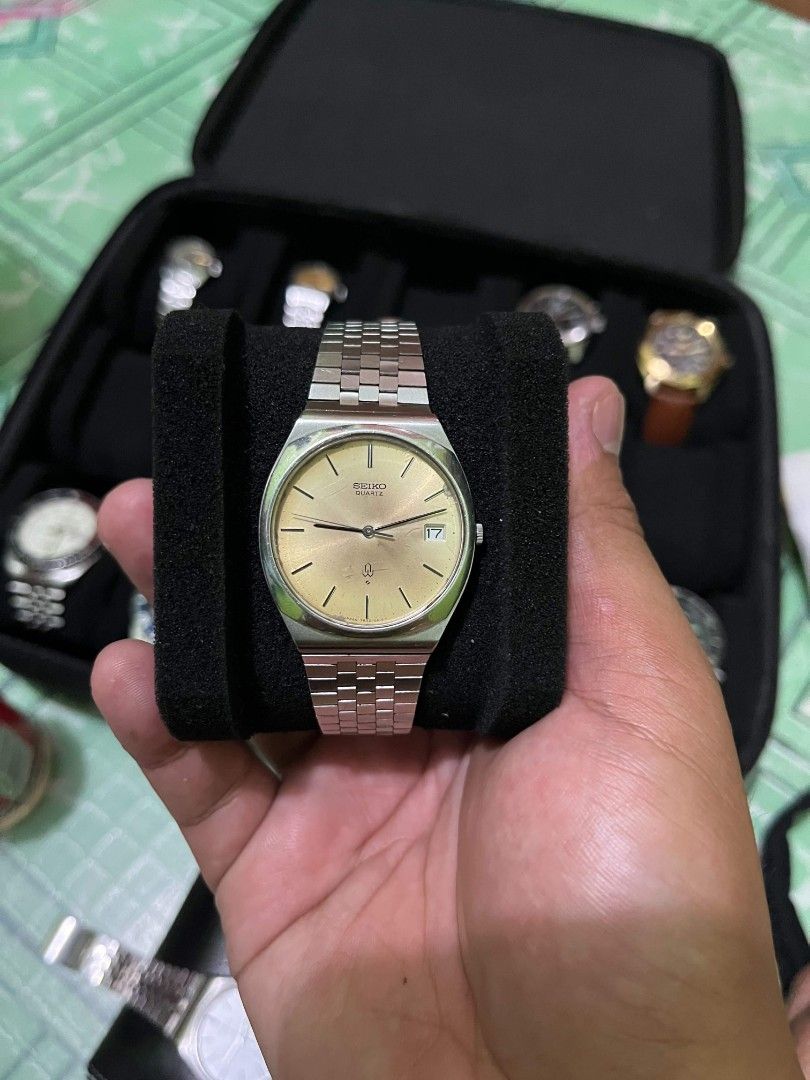 Seiko Quartz Watch Gold Dial Date Window (Category: Luxury Watches) located in Cebu City. Submitted by jbok_watches. (Listing ID 1459634697, Image 2). Description: - Vintage Seiko Quartz watch - Elegant gold dial with date window at 3 o'clock - Durable stainless steel bracelet - Case back model number: 6030-5040 - Requires a new battery - Sold as is.
