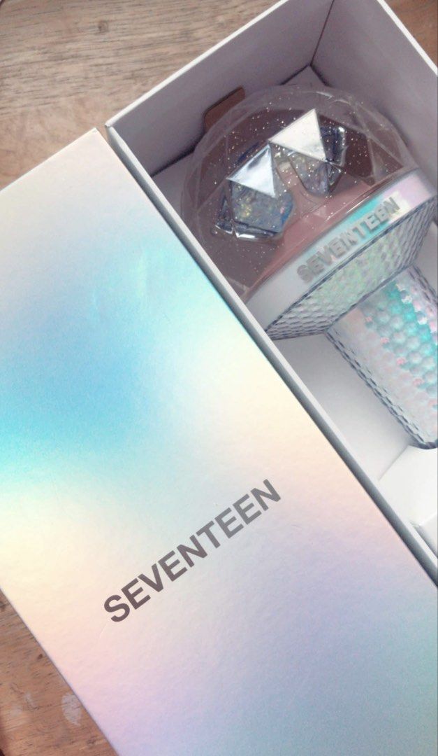 SEVENTEEN Official Lightstick Ver 2 (Category: K-Wave Merchandise) located in Valenzuela. Submitted by bea.boutique (Listing ID 1459687312, Image 1). Description: - SEVENTEEN Official Lightstick - Comes in original holographic box - Features a clear, faceted globe top with 'SEVENTEEN' text - Handle has a textured, iridescent finish - Ideal for SEVENTEEN concerts and fan events.