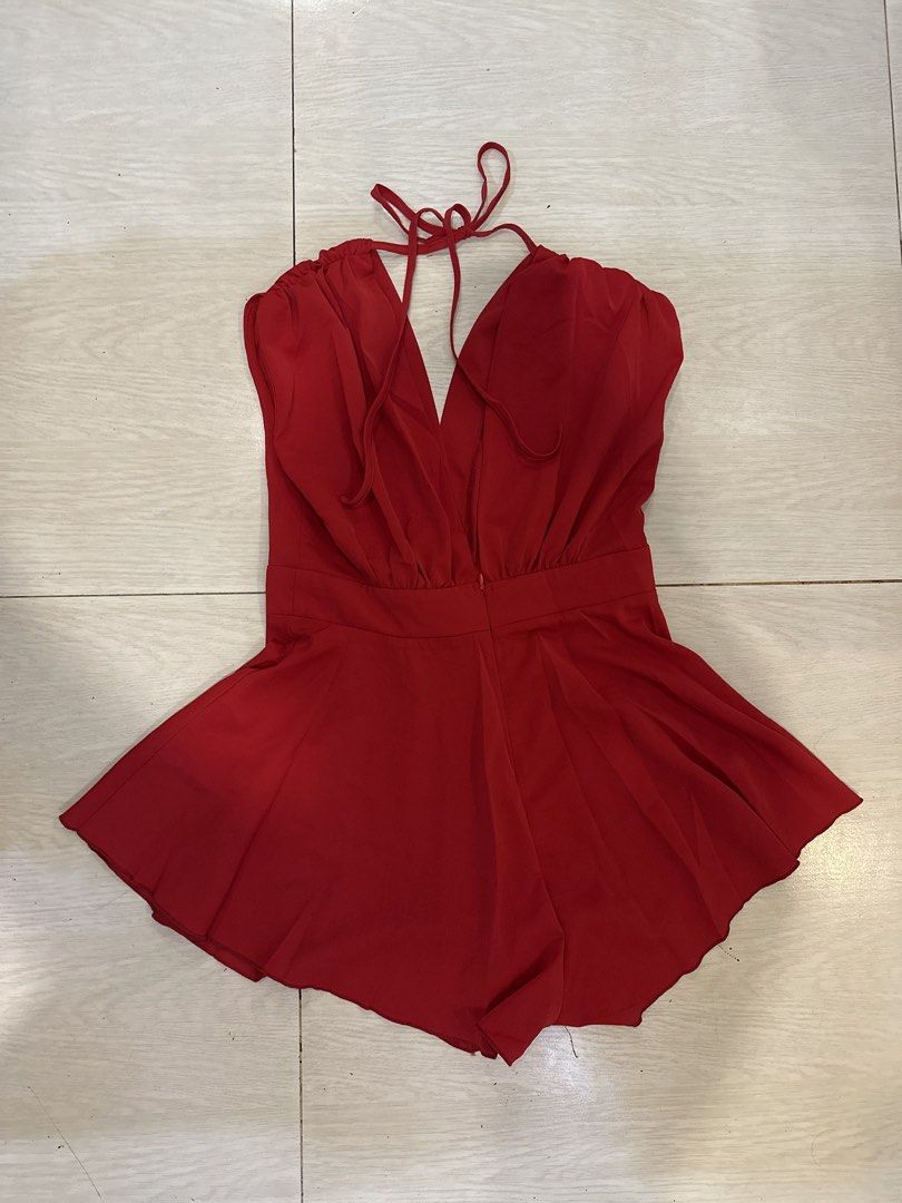 SHEIN Red V-Neck Tie Back Romper (Category: Rompers) located in Rizal. Submitted by rann1121 (Listing ID 1459603524, Image 2). Description: - Red romper from SHEIN - Deep V-neck with tie-back detail - Elasticated waistband for comfort - Flared shorts for a stylish look - Made of 100% polyester - Versatile: great for night outs or casual days.