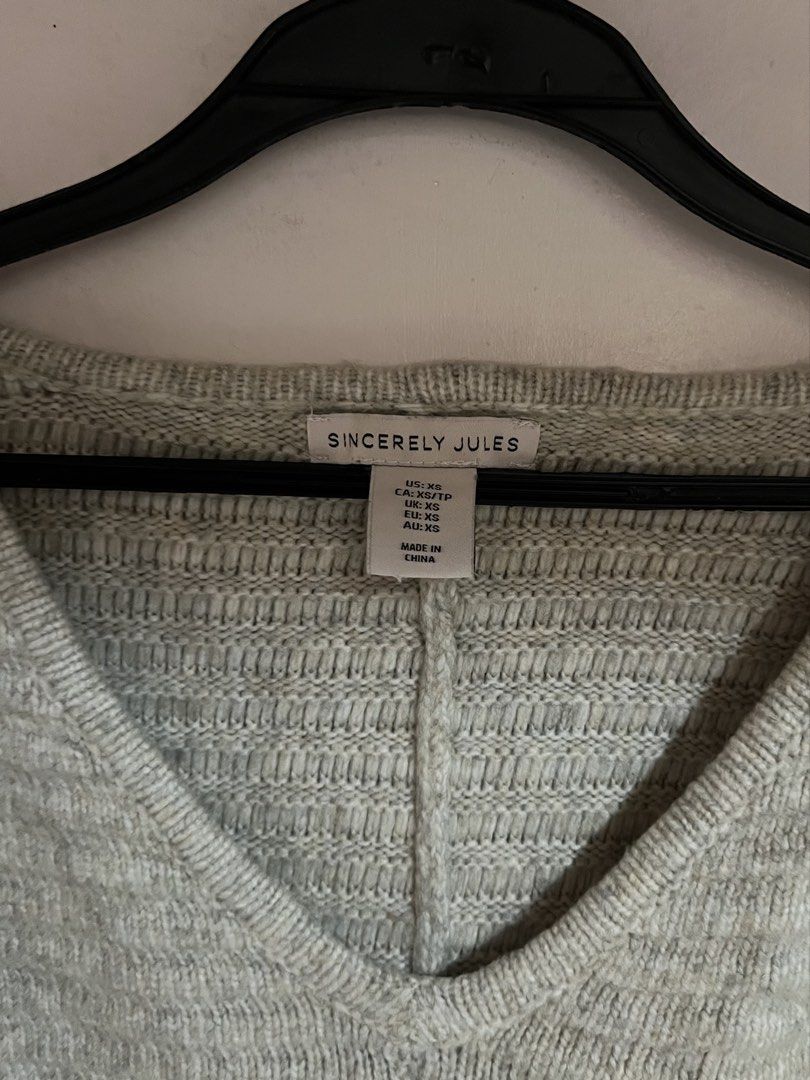 Sincerely Jules Knit V-Neck Sweater (Category: Coats, Jackets and Outerwear) located in Gapan. Submitted by ar_armey (Listing ID 1459534309, Image 2). Description: Original Price: ~$38 USD (~₱2,100) Brand: Sincerely Jules Color: Light Heather Grey / Oat Grey Size: Extra Small (US / CA / UK / EU / AU: XS) Condition:Excellent condition (clean knit, no visible flaws) Details: Soft textured knit pattern, flattering V-neckline, relaxed/slightly droppe