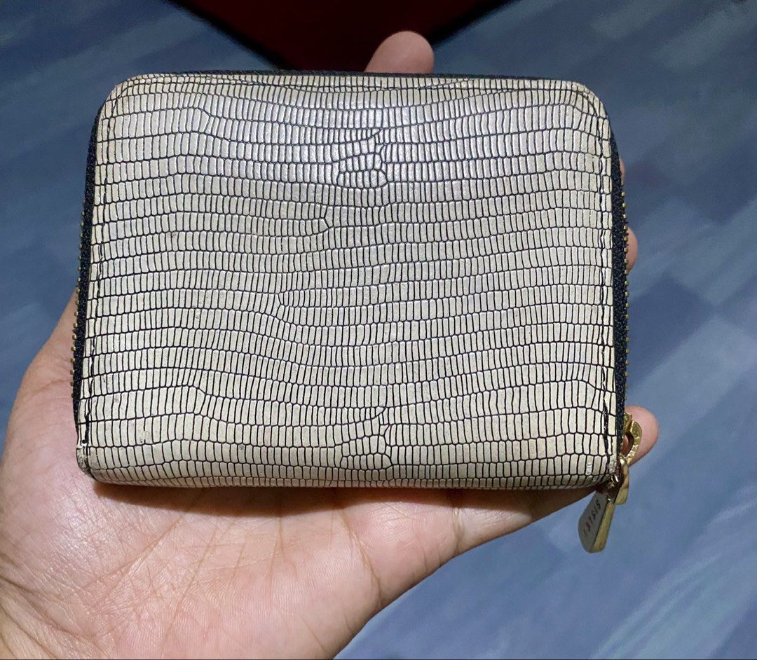 Sisley Zip Around Wallet Lizard Print (Category: Wallets & Card holders) located in Roxas City. Submitted by rowvee. (Listing ID 1459640923, Image 2). Description: - Stylish Sisley wallet with a cool lizard print texture. - Elegant gold hardware details, including zipper pull and logo plate. - Secure zip-around closure to keep your essentials safe. - Compact size, ideal for everyday carry or travel. - Easily fits into pockets or small bags..