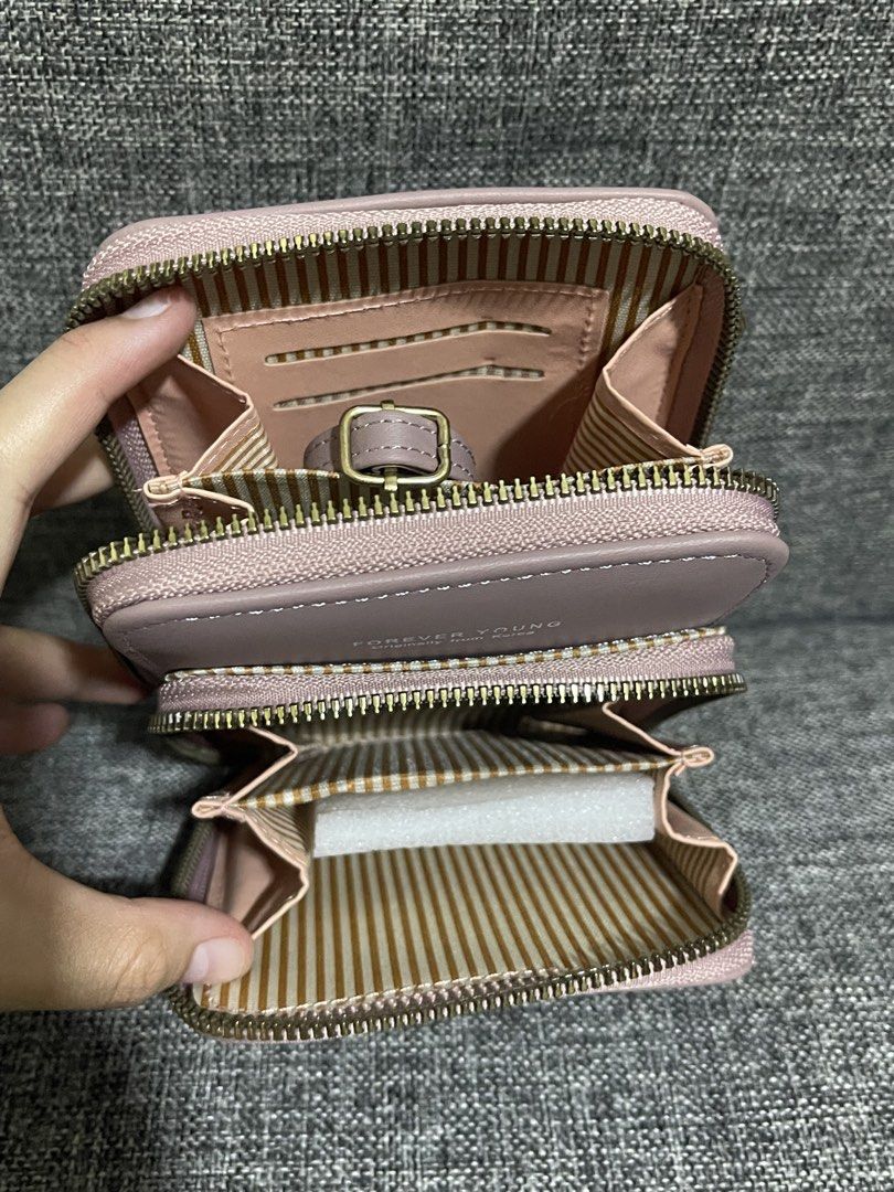 Sling light pink wallet (Category: Wallets & Card holders) located in Quezon City. Submitted by tresheaven (Listing ID 1459637068, Image 2). Description: .