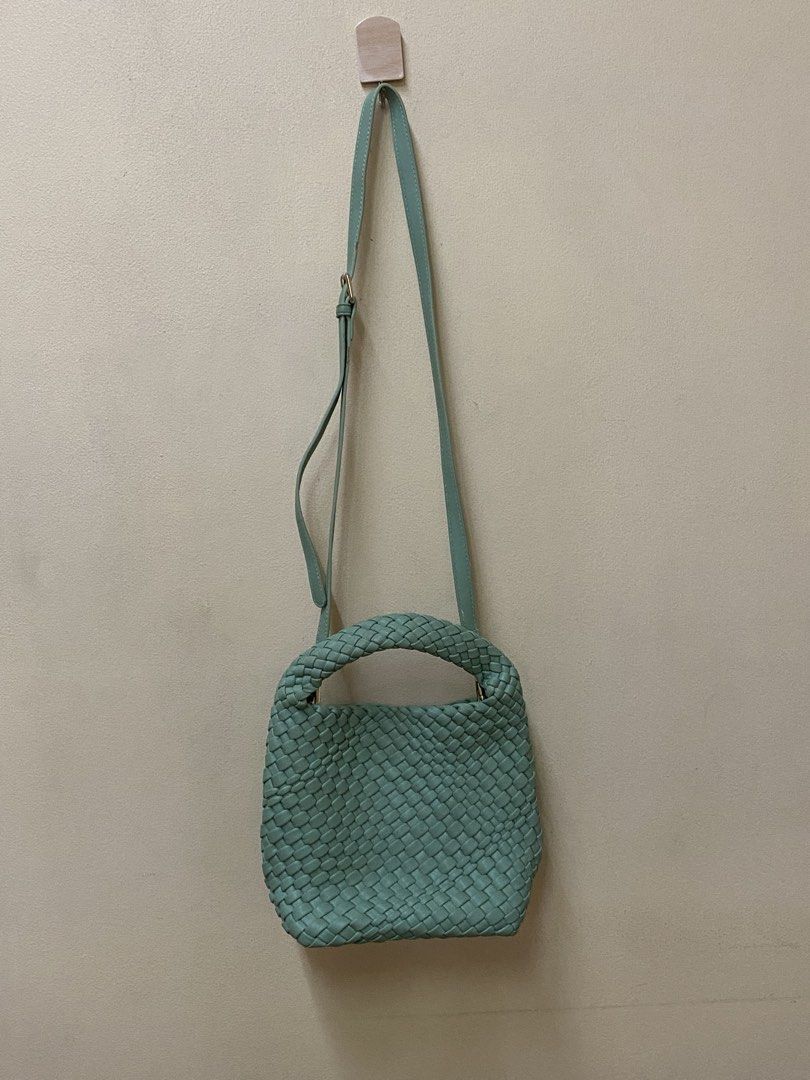 small Mint Green Woven Handbag with Shoulder Strap (Category: Shoulder Bags) located in Lucena. Submitted by totaldeclutter (Listing ID 1459545163, Image 2). Description: - Adorable mint green woven handbag - Features a convenient top handle - Includes a detachable and adjustable shoulder strap - Note: Small scuff on the strap near the buckle - Versatile for everyday use or evening outings.